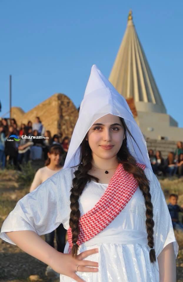 A Yezidi girl in traditional clothes in front of Yezidis temple.
This traditional clothes are used for brides in some Yezidi areas.
#Êzidxan 
#YazidiCulture