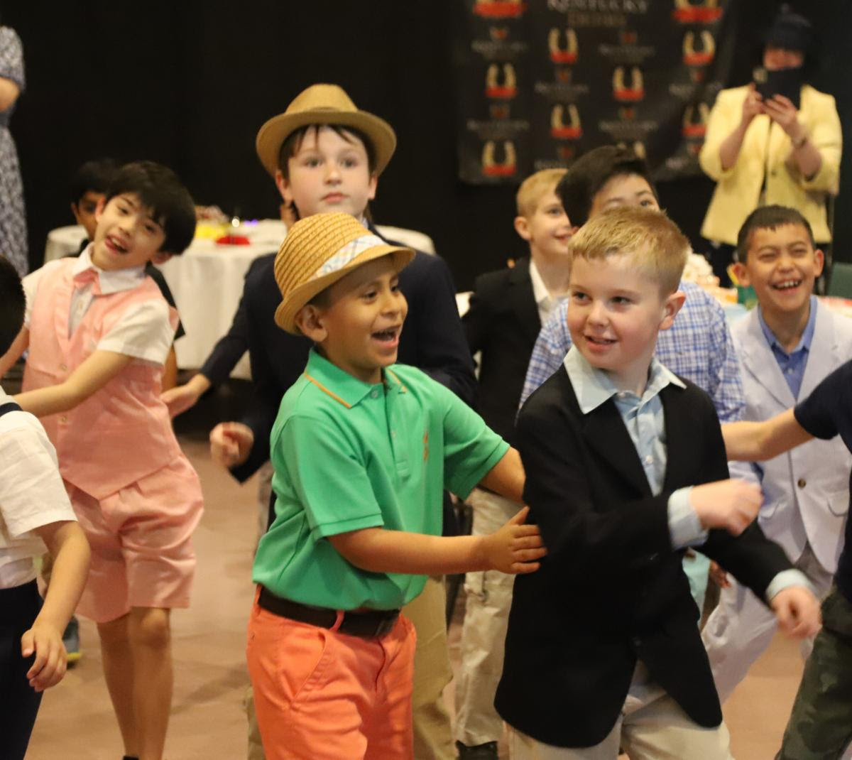 westminster_va's tweet photo. We celebrated the 149th running of the #KentuckyDerby with a special luncheon for K-4 boys and their moms (or other special guests). The couples, dressed in their Derby Day finest, enjoyed picnic fare, themed games, and dancing! 💚🏇
#westminsterschoolva #wsgriffins https://t.co/uEwNuvXbJZ
