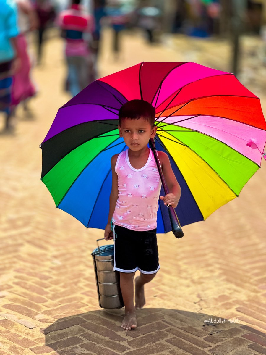 The rainbow 🌈 kid~

A Rohingya young boy with a big colorful umbrella was carrying a tiffin for his father.

#rohingyaboy #tiffin #refugeecamp #umbrella #rohingyaphotography #rainbow #streetphotography #photojournalism #portraitphotography #photomagazine #rohingyalife #story