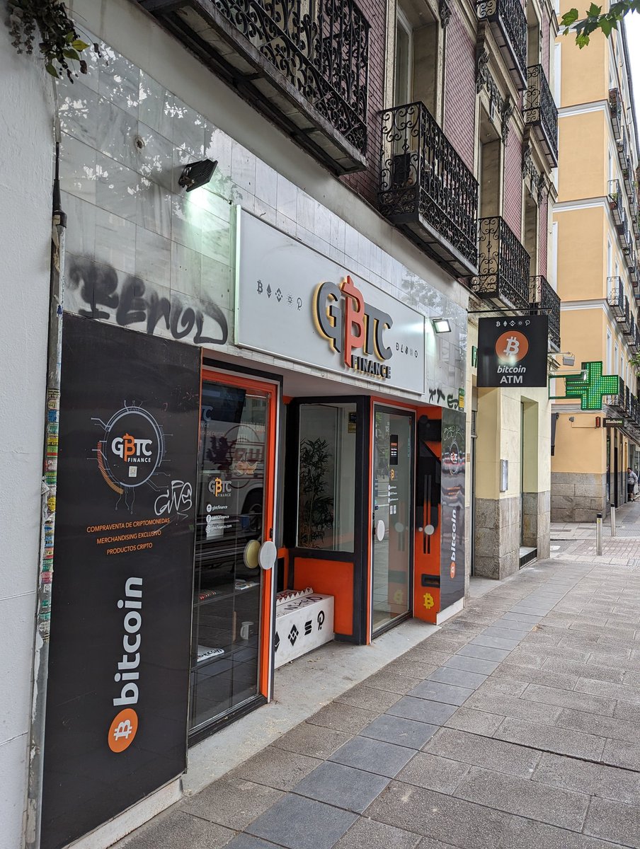 Bitcoin ATM and service point on the street of Madrid.