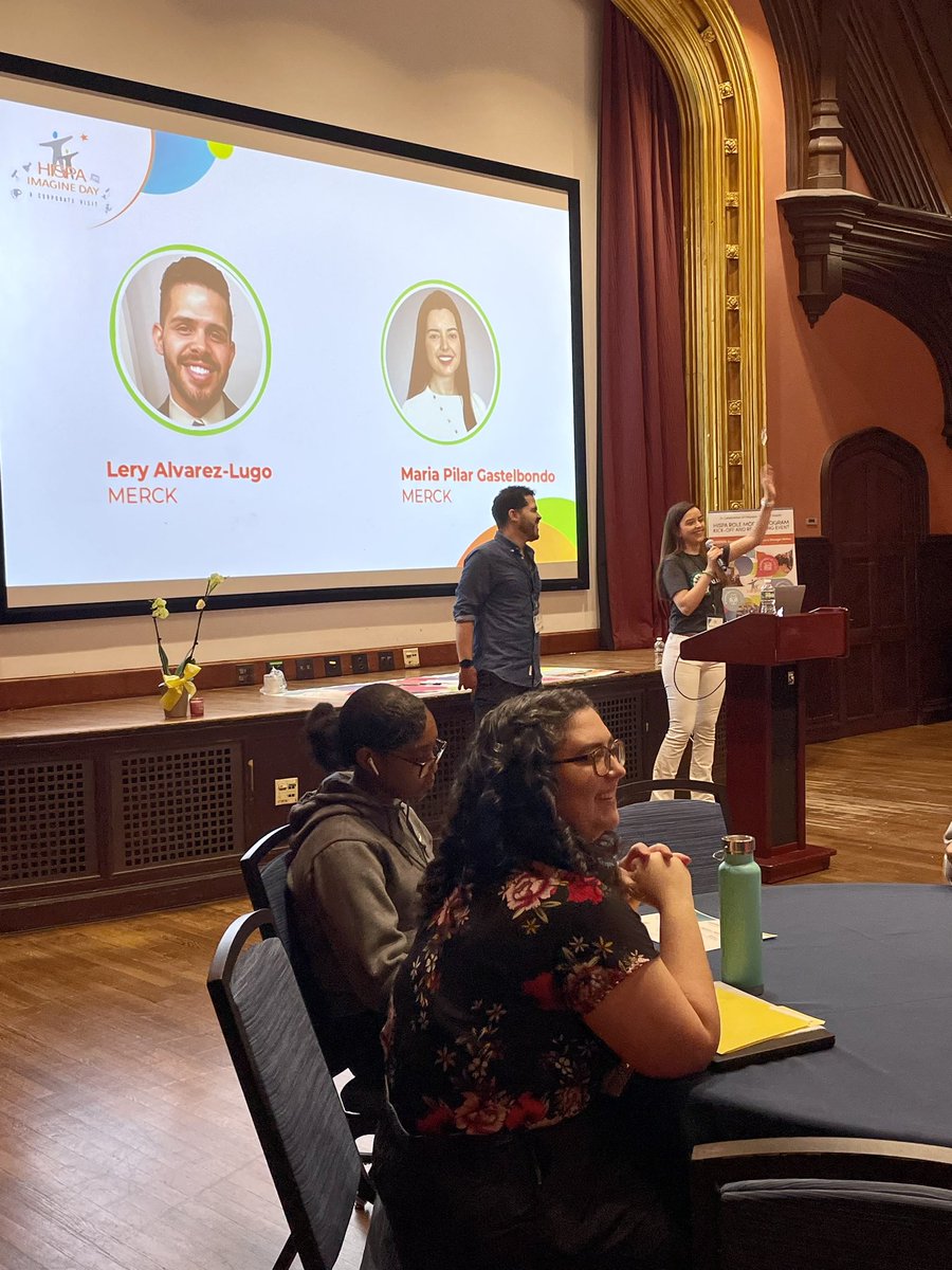 Volunteers from <a href="/Merck/">Merck</a> Alianza open the day by sharing how they ended up in the United States and working in STEM.