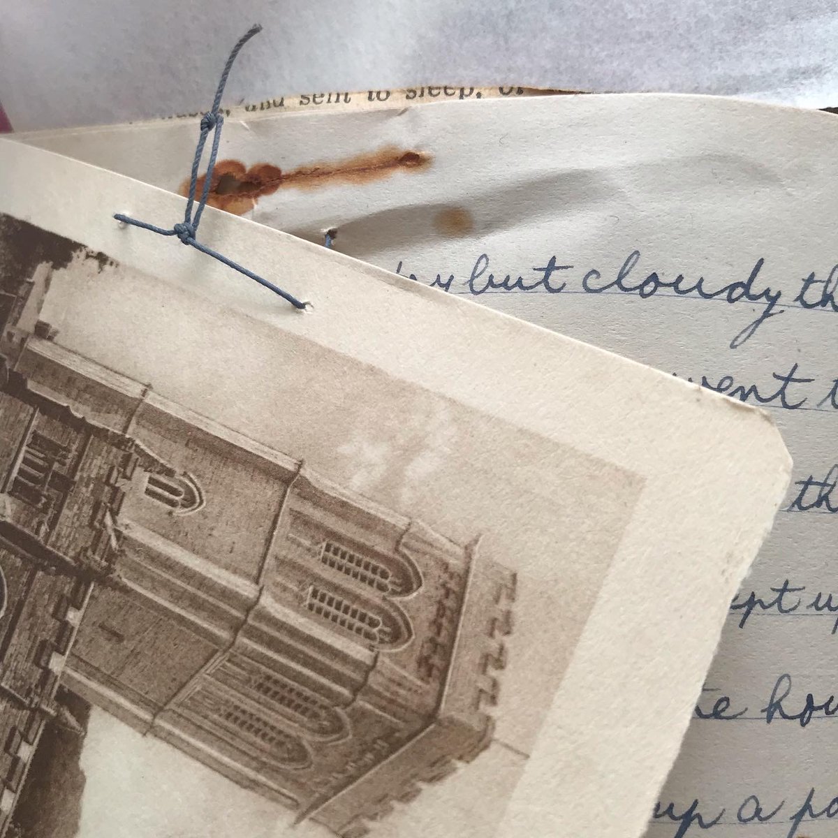 As we go through these wonderful journals, there’s  evidence that their maker performed some conservation himself! Old rust stains suggest that ephemera were originally fastened with a metal pin. These were later removed, and the inserts reattached with a loop of thread instead!