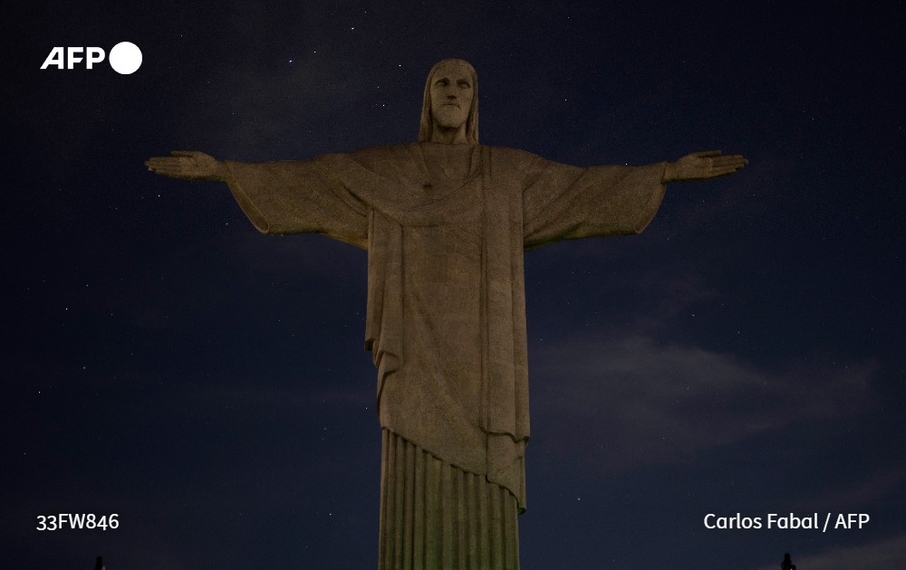 #AFP photographer <a href="/Carlos_Fabal/">Carlo Fabal</a> captures the Christ the Redeemer statue without illumination to condemn racist acts against Brazilian footballer #ViniciusJr in Rio de Janeiro, on May 22.