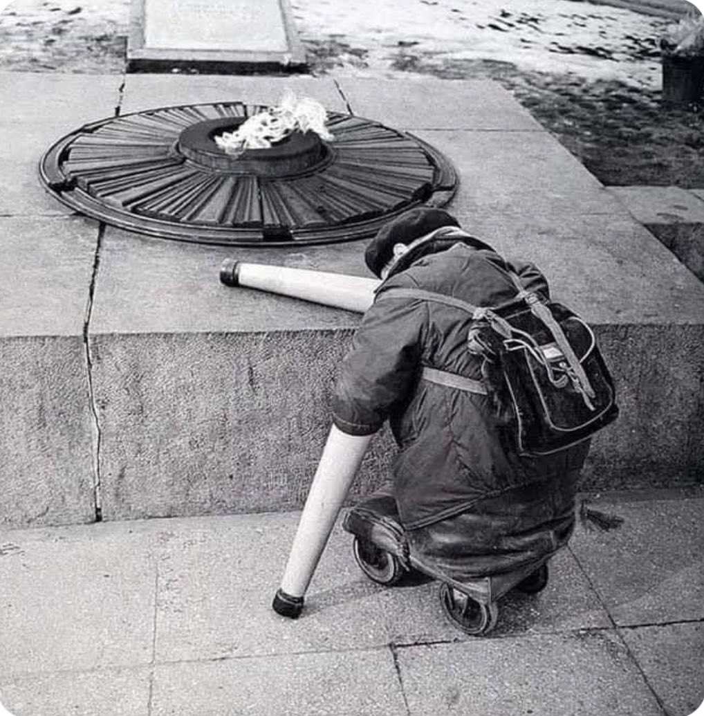 A soviet war veteran near the Eternal Flame on the anniversary of Victory Day, 1966.