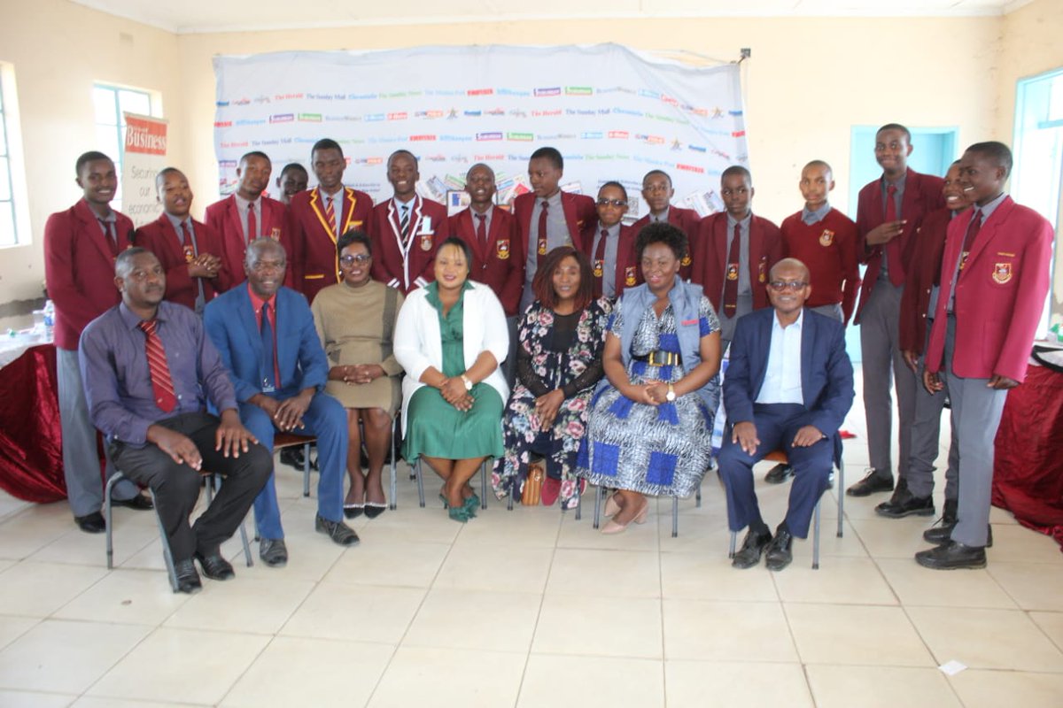 Zimpapers stafers Ishmael Ndlovu, Pauline Matanda and Fatima Bulla-Musakwa (3rd from left) pose for a photograph with teachers and learners from St John's Chikwaka high school at the launch of the Zimpapers Junior Media Club at the school.

#GetThePicture #Zimbabwe