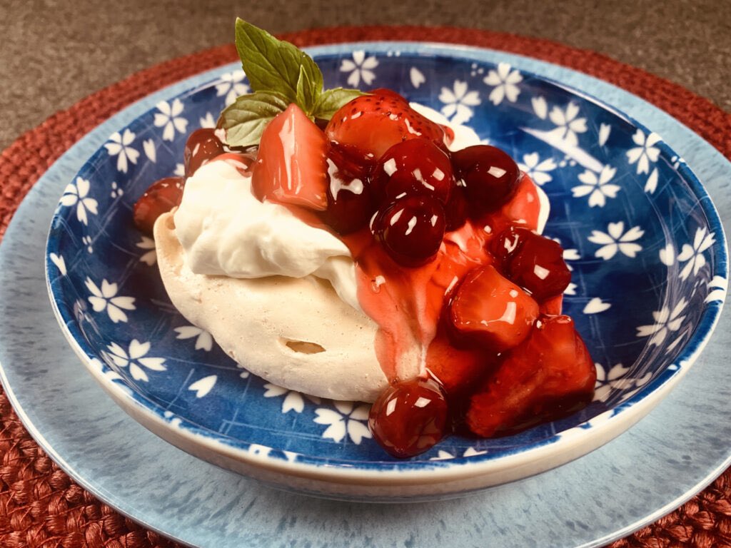 Cherry Berry Meringue “Clouds” are a regal looking dessert; crisp with a bit of cream & a berry cherry sauce. The #glutenfree free meringues are easy and ready for a weekday celebration. Find the #recipe gloriagoodtaste.com #recipes