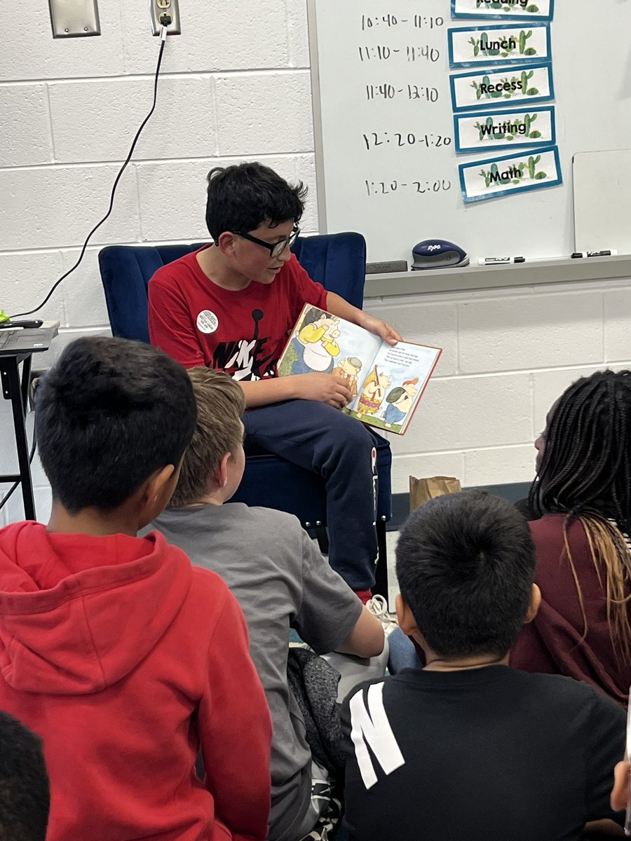 MrsNeff5th's tweet photo. These 5th graders are reading their favorite picture book from their elementary school journey! Who remembers Brown Bear, Hey That’s My Monster, Where the Wild Things Are, or There Was An Old Lady Who Swallowed A Fly? @Discovery_elem https://t.co/bWEcbMcJXT