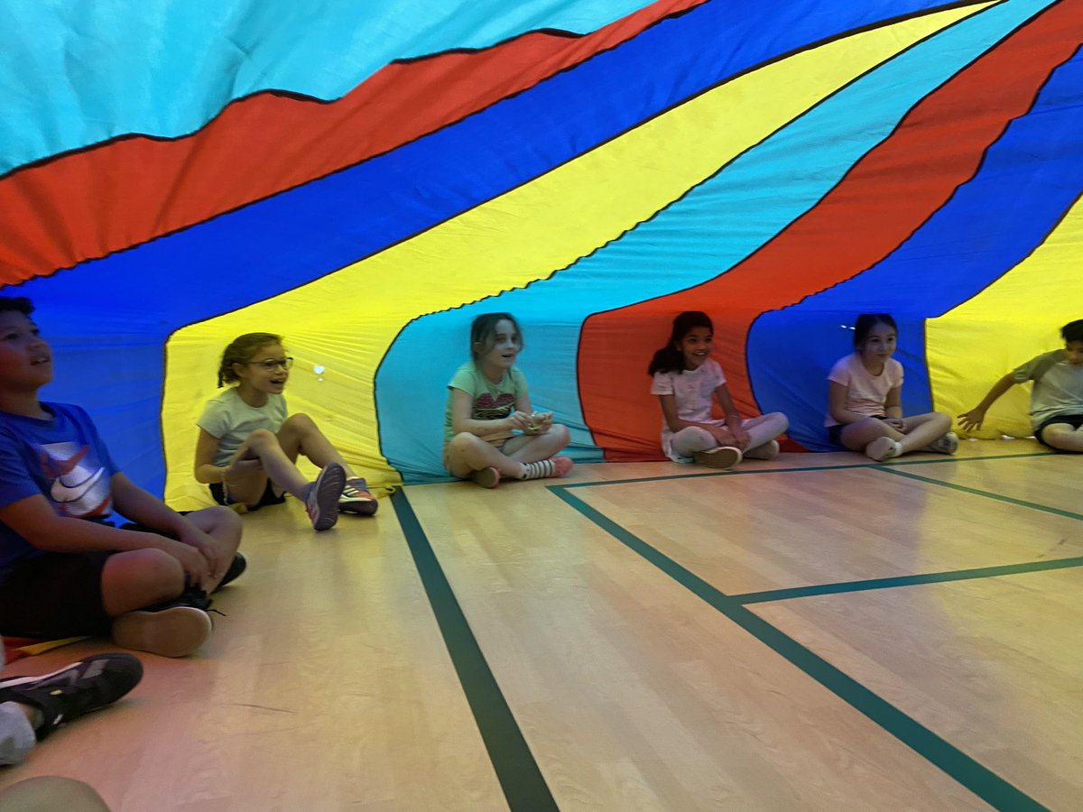 CPESspecialist's tweet photo. Kinder-2nd grade are working on their parachute games in preparation for field day #cpesbelieves https://t.co/l5bvqBCZZn