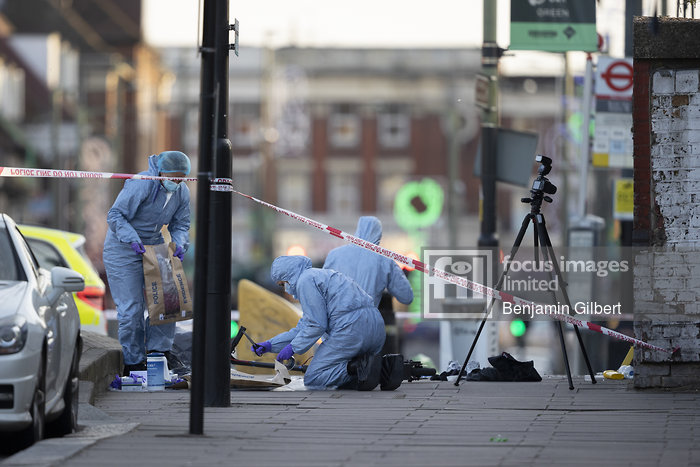 Forensic Officers search the scene outside Burnt Oak Station, London after a boy, was rushed to hospital after a 'shooting' outside the station.

Benjamin Gilbert/Stella Pictures Ltd