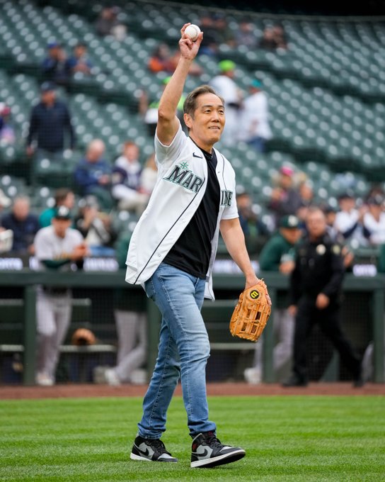 Yuji Okumoto waves to the crowd as he takes the field for the ceremonial first pitch. 