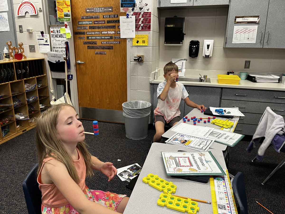 Showing off our skills with our Minute to Win It” games! It is very hard to pick up tiny cubes with your elbows😅😂 ⁦<a href="/AESPanthers/">Aboite Elementary</a>⁩ #minutetowinit