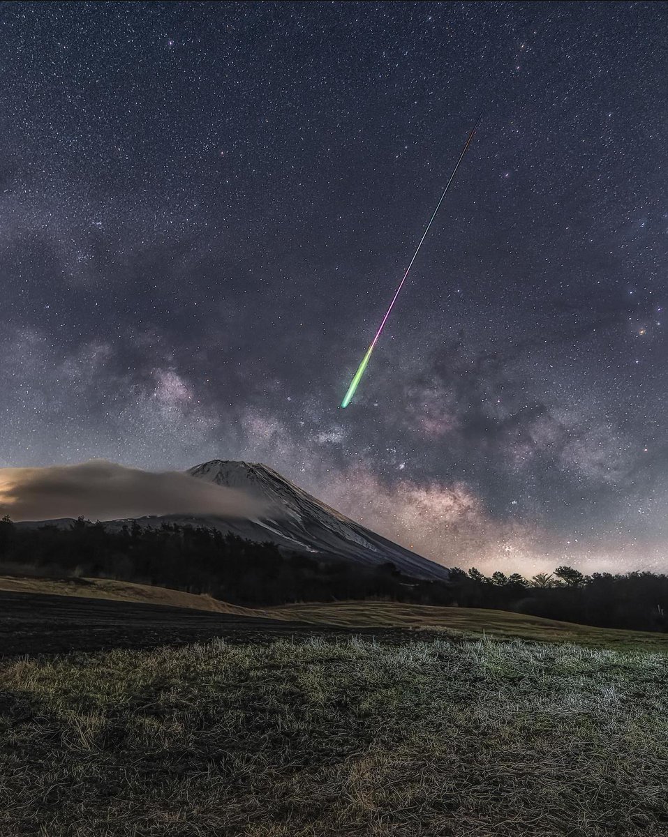 A meteor, the Milky Way and Mount Fuji, Japan.
