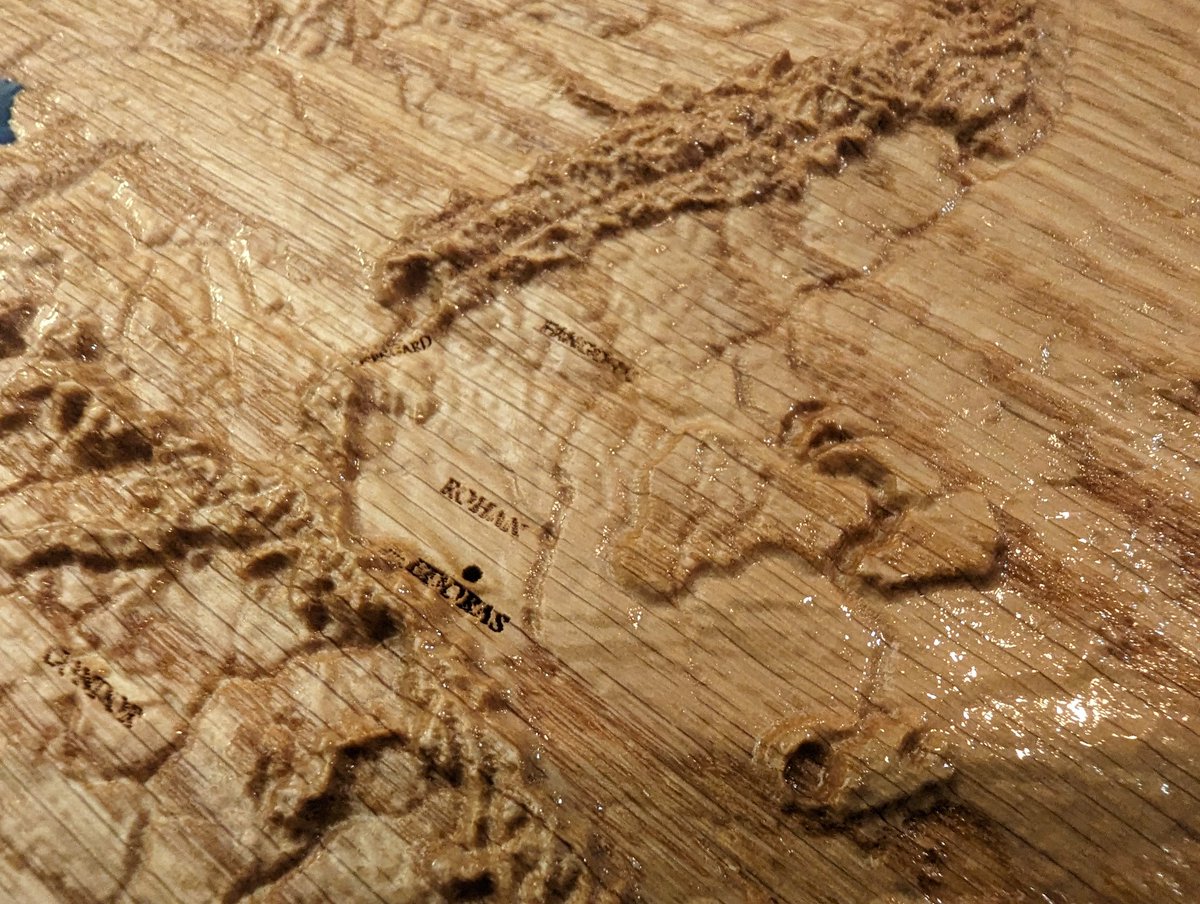 jmauser's tweet photo. Middle earth Topographic map in red oak with epoxy fill. My nerdery has reached a new low/high https://t.co/u4V2nV63qe