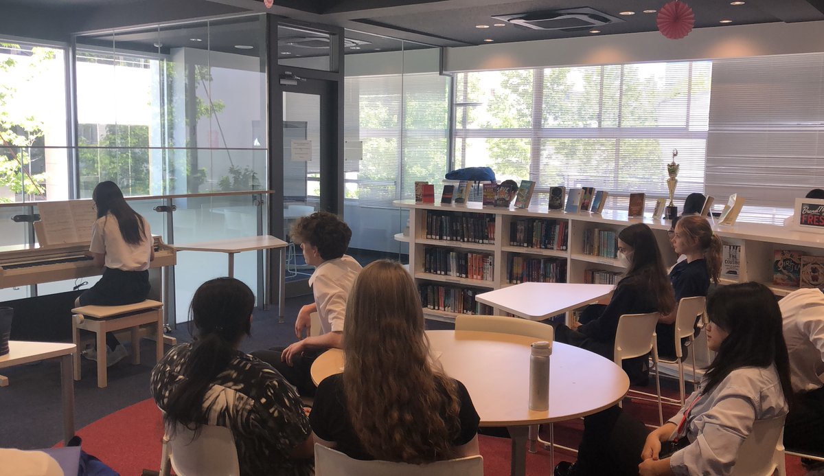 BST_SecLibrary's tweet photo. Brilliant 'Wednesday Lunchtime Concert' in the library today! Aiko &amp;Esther played beautiful pieces by Faure &amp;Chopin, followed by Tom's super rendition of a Nat King Cole number. 33 students from all years formed the audience. A wonderful musical interlude! @BST_Tokyo #BSTArtsFest https://t.co/ovsPrhqfl7