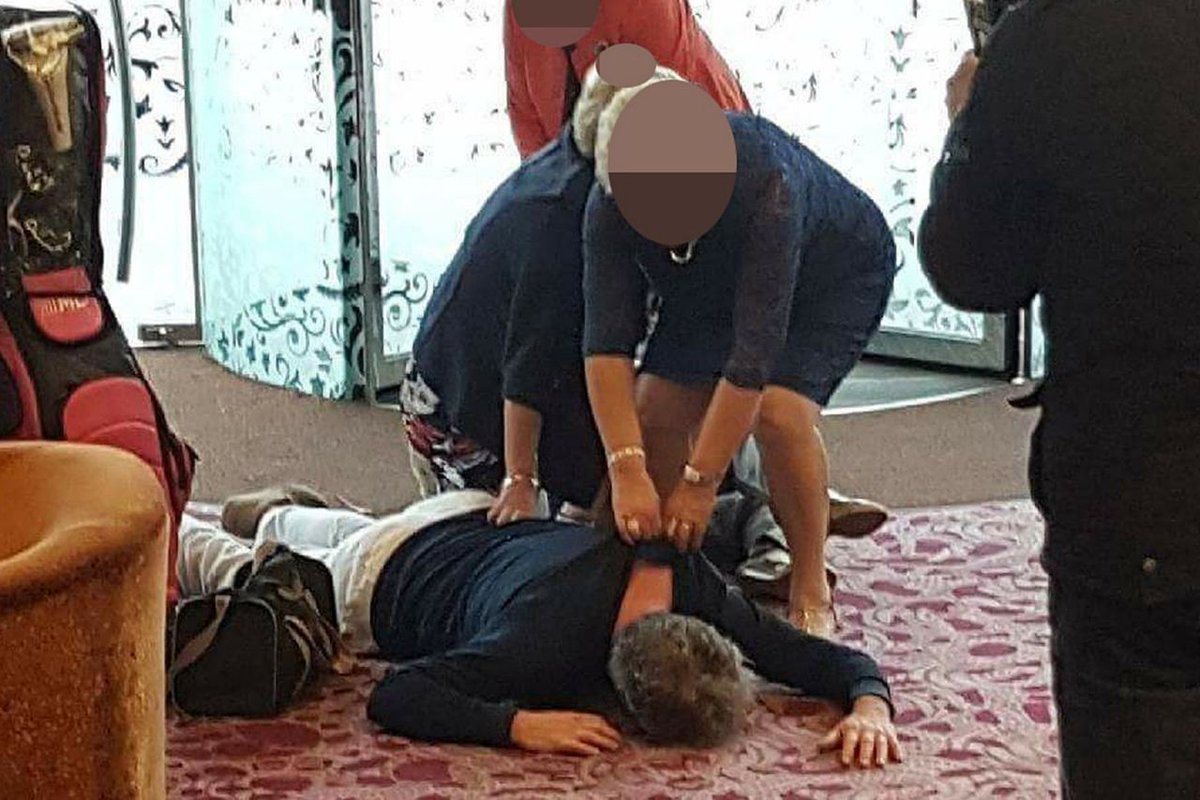 Former UUP leader Mike Nesbitt is pictured lying face-down in the lobby of the Stormont Hotel. He said the incident was "just banter and play-acting". (May 2017)