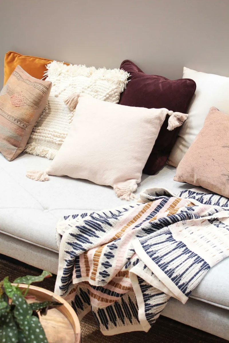 Time for a spring refresh? Try changing out throw pillows for a quick and affordable update to your living room. #HomeDecor #DIYHome #HomeImprovement #PinnacleRealtyPartners #SpringRefresh