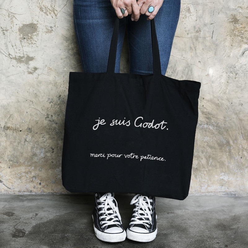 Standard_D's tweet photo. Waiting for Godot? No more! With our chic tote bag, YOU are Godot! A fun nod to Beckett's play for literature lovers. Don't wait, grab yours now! #SamuelBeckett #WaitingForGodot #LiteratureLove