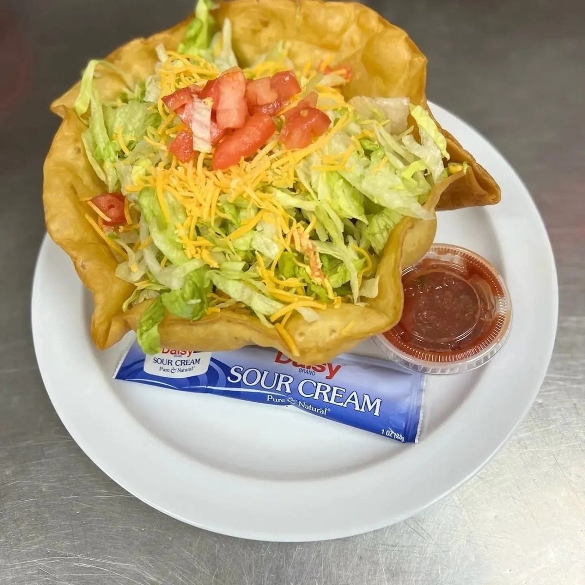 Wednesday's Lunch Special: #WeezesCafe's Taco Salad.  A crispy fried tortilla filled with seasoned chopped meat, fresh lettuce and tomatoes & cheese $8.99.  We start serving at 11:00 a.m.   :) (918) 337-0881 weezescafe.com #bartlesvilleok #eatlocal #tacosalad