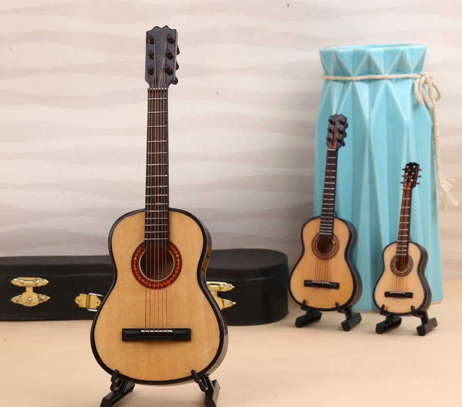 designsbycay's tweet photo. #MiniAcousticGuitar with #CaseandStand, #Display Cute #Dollhousedecoration, #Musician #Deskdecor #KnickKnack, #Giftidea #forMusiclovers, #TinyArt #miniguitar #guitardisplay #guitarwithcase #dollhouseguitar #acousticguitar #musiciangifts #guitar https://t.co/J89pU6N0hP https://t.co/UF9jaVWUq9