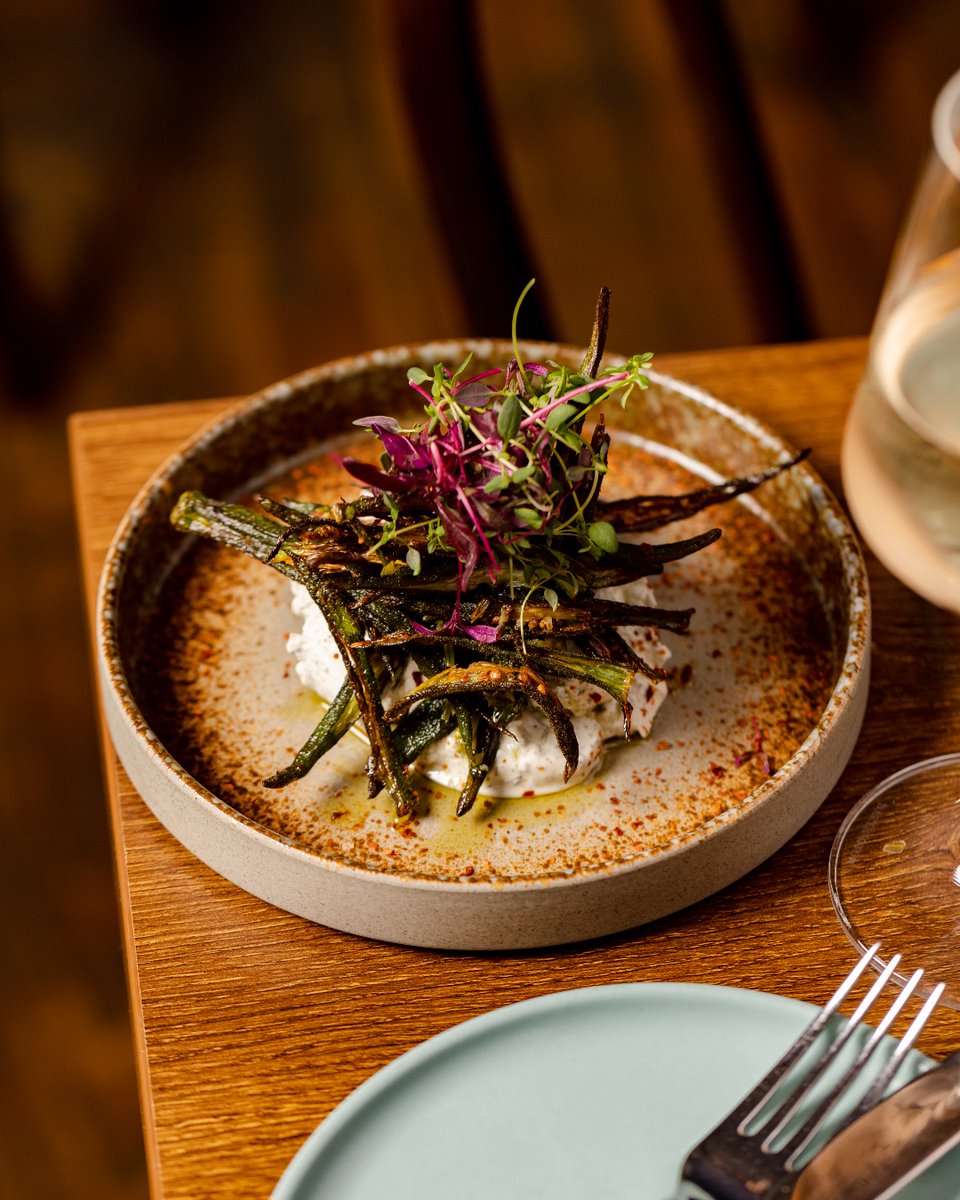 A Syrian sharing mezze classic and a guest favourite. Our Mtafayt Bamyeh has been on the menu since the early days; described by Jimi Famurewa as "smartly roasted fingers of okra, blobbed with a coriander paste, and playing against the freshness of a cloud of labneh"