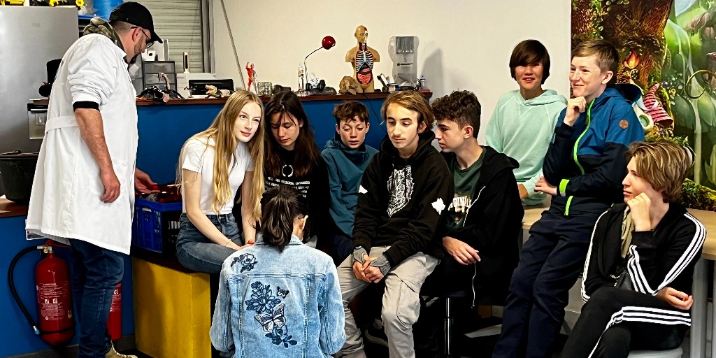 ISRsenior's tweet photo. Salut from Lyon and #ISRgrade7_8! Day 2 included an e-bike tour, and a visit to Les Savants Fous (the mad scientists) ... but is everything OK with Mr Timmel? 🧑‍🔬🔥🚒  @ISRheintal https://t.co/SWku8kDc7V