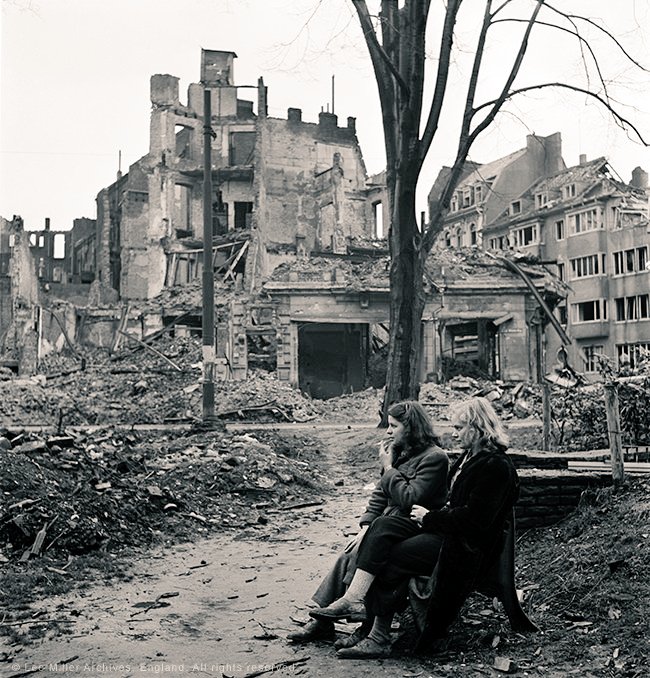 World War II photographer Lee miller, Two German women sitting on a park bench, Cologne, Germany,1945 #WomensArt