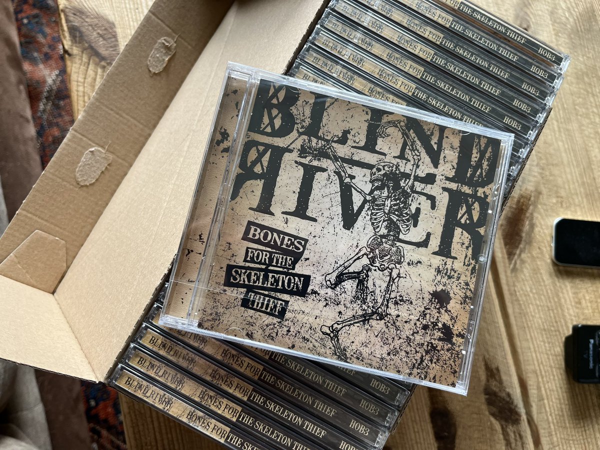 It appears that “Bones For The Skeleton Thief” has begun appearing on peoples doorsteps! 

If yours hasn’t arrived yet, please be patient. The UK postal service is run by corporate filth, and Blind River is run by musicians. There may be the occasional delay! 😆