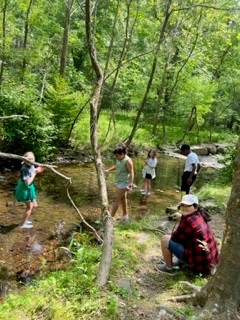 4th graders explored the Chesapeake Bay Watershed locally by visiting the Snakeden Branch stream and Lake Audubon. They checked the quality of water and living signs of a healthy habitat as part of the Walker Nature Center educational programs.