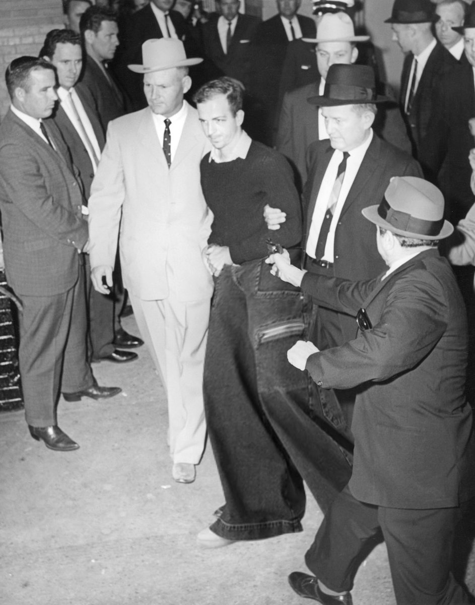 WIFE: Can you pop down to the drug store really quickly to pick something up for me?

ME (Photoshopping JNCOs on to Lee Harvey Oswald just before his assassination by Jack Ruby): Maybe later.