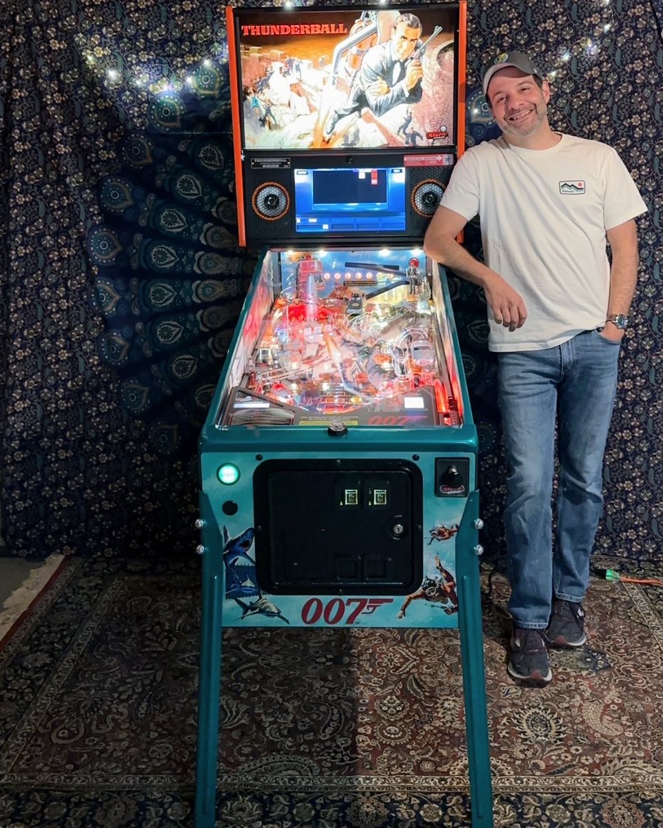 ProjectPinball's tweet photo. Look at that smile! Brian Caromile sent us this joyful picture of himself with his new James Bond LE after winning the raffle! Thank you for sharing your excitement with us, Brian, and of course for supporting our mission❤️ #ProjectPinballSuperFan https://t.co/AJLWDImDZX
