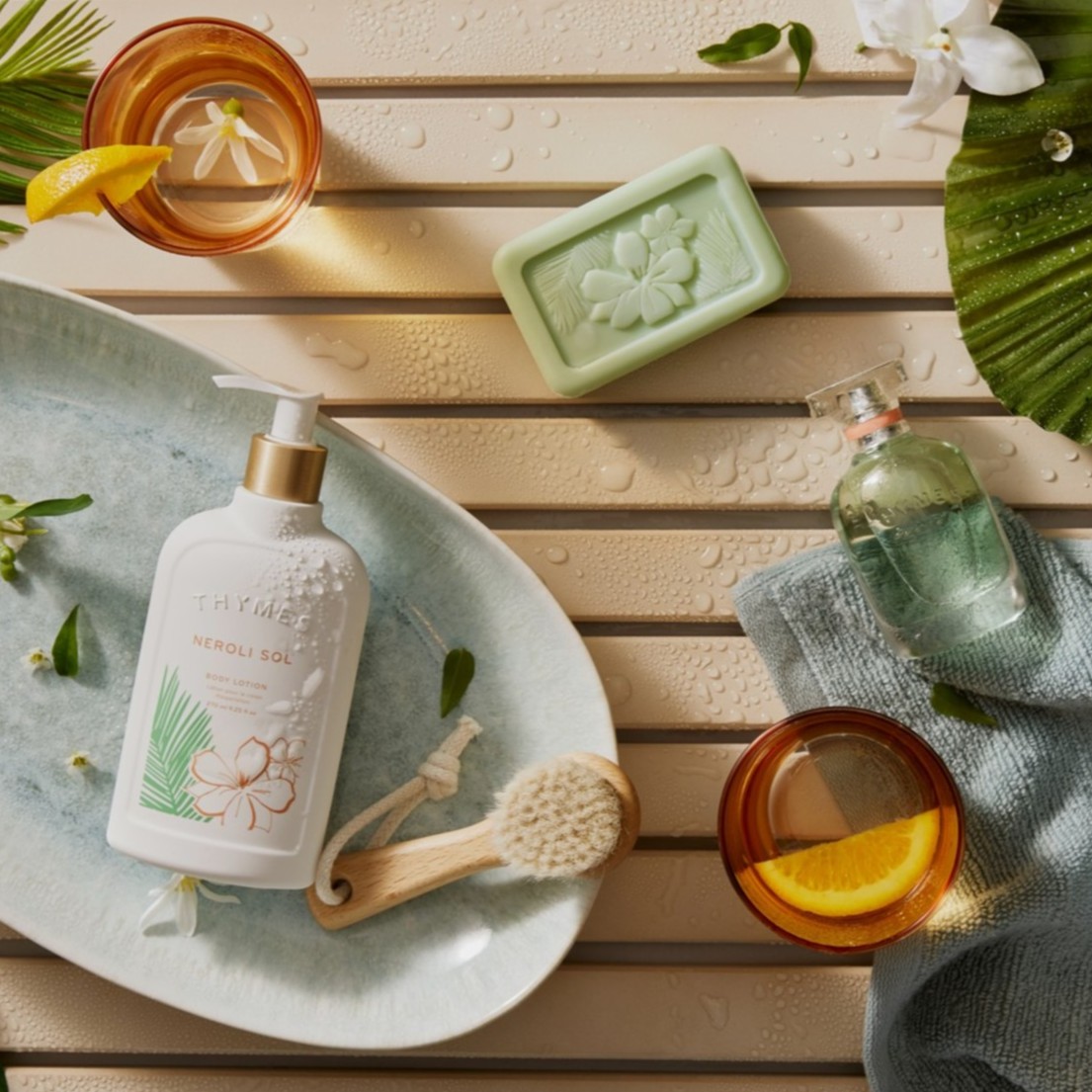The perfect backdrop of golden sun, balmy winds, and lush palm leaves. The Neroli Sol collection beckons a moment of blissful freedom.