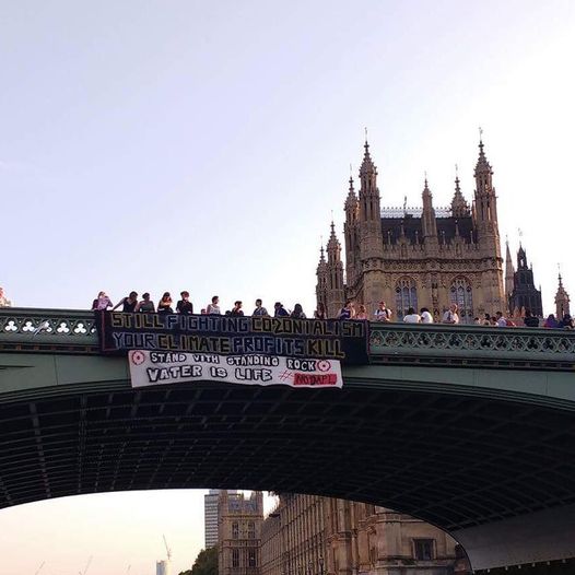 Sept 2016
Hanging a banner from Westminster Bridge over the River Thames outside the Houses of Parliament.

We just took action with friends and allies who are holding the line at Sacred Stone Camp! From London to Dakota sending solidarity, the world is watching! #nodapl