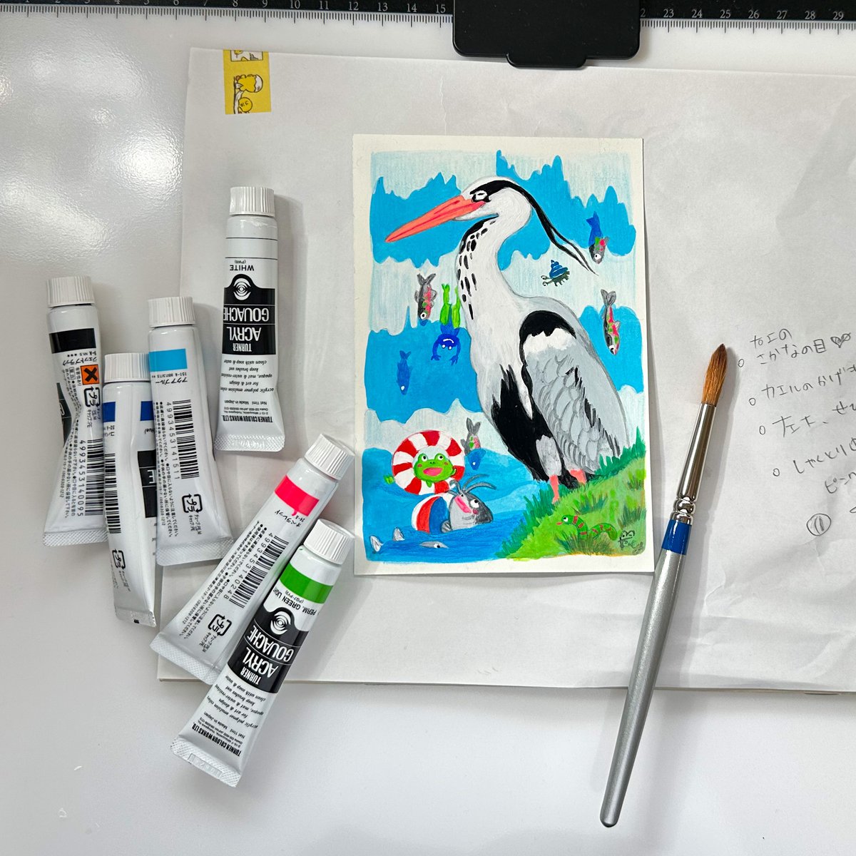 『アオサギと楽しい仲間たち』（エサじゃありません🐸）今回は初めてアクリルガッシュ＋色鉛筆で作成です。ちなみに2枚目は片付けてから写真のためにカッコつけて再びわざわざ画材を並べました✨ https://t.co/lBLZKPboD6