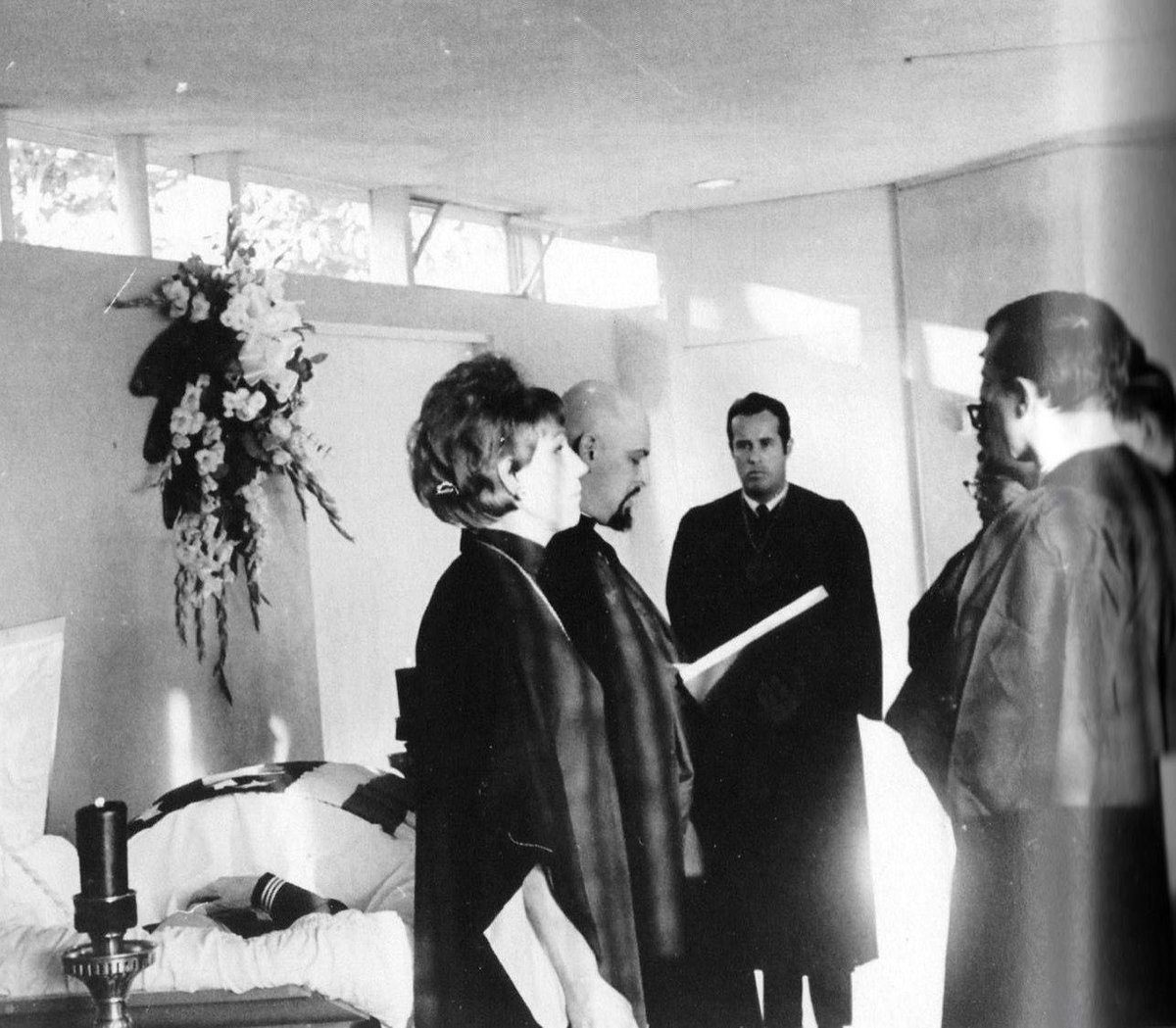 ChurchofSatan's tweet image. Anton LaVey and Kenneth Anger conducting a Satanic funeral for Navy machinist Edward D. Olsen. The ceremony included a Navy honor guard who fired three volleys with their rifles, and a Navy musician played taps after the mourners shouted, “Hail Satan!” and “Hail Edward!”