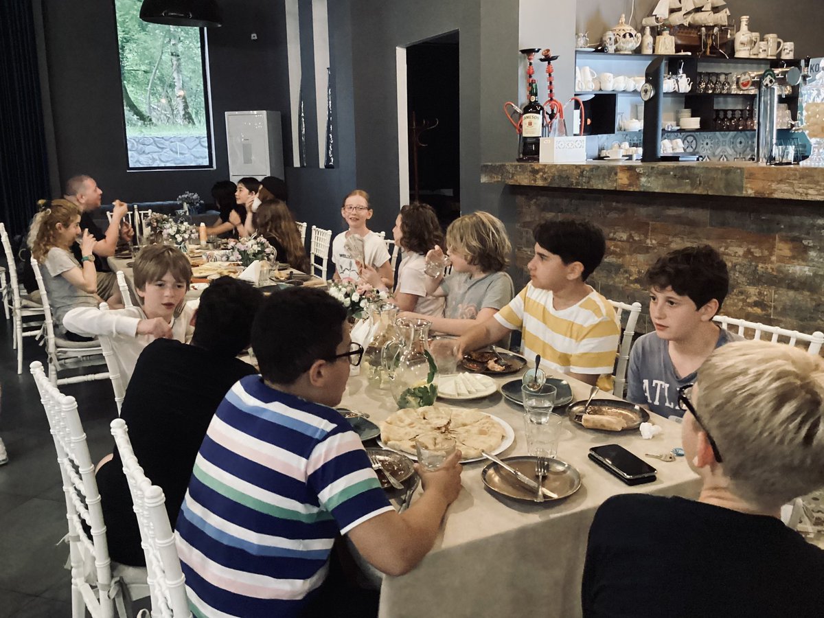 Enjoying a pleasant dinner after a fun day.