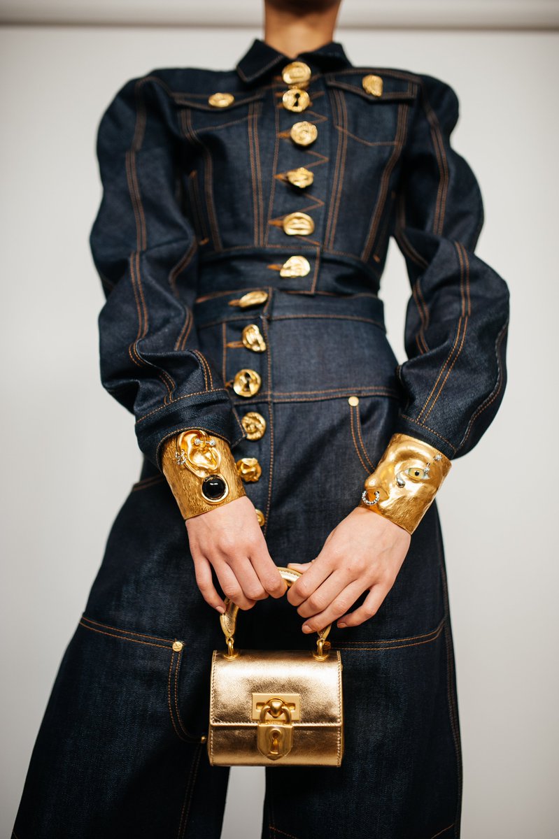 Schiaparelli Ready-To-Wear Fall/Winter 2023 double denim designed by  #DanielRoseberry. Japanese raw denim. Schiaparelli Gold bijoux buttons.  Extra wide high-waisted cowboy pants.