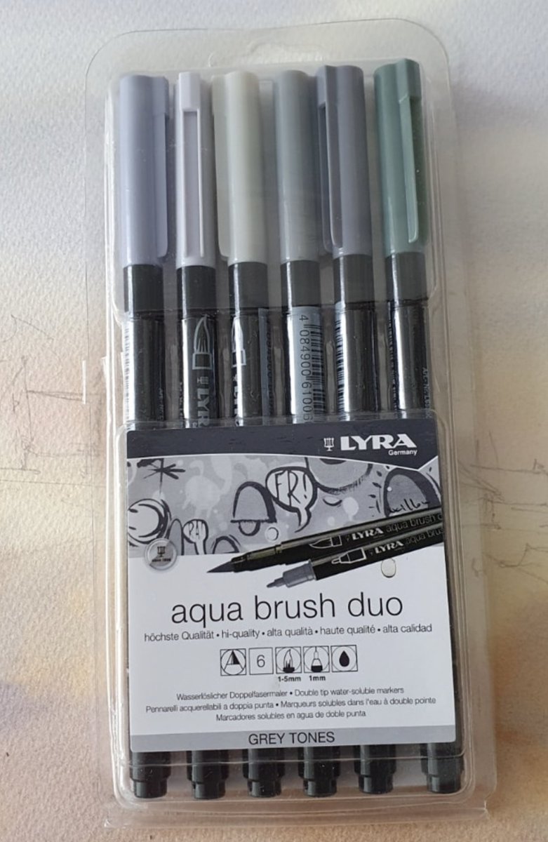 Playing with grey felt pens.