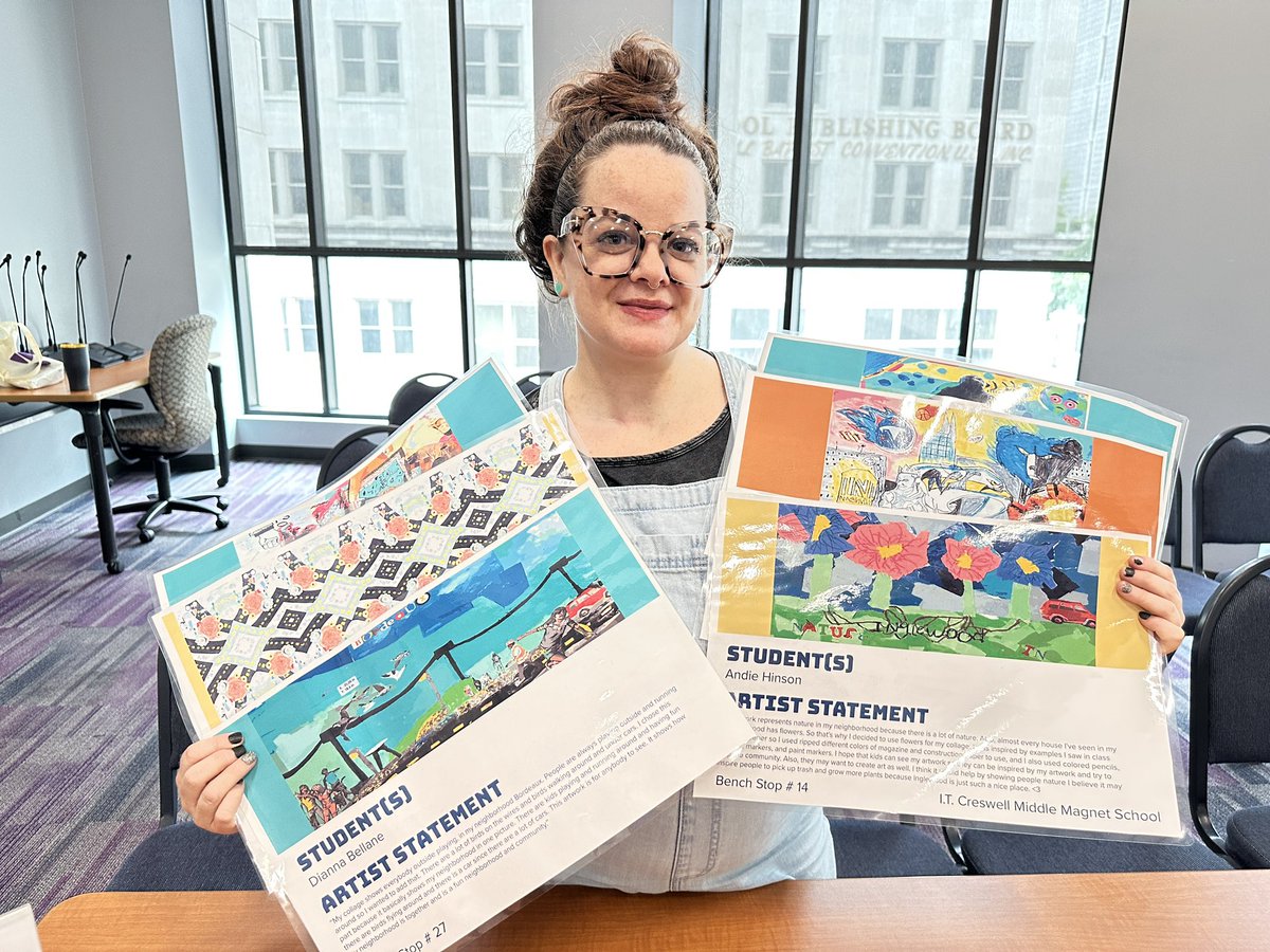 Kelsea Shaw, <a href="/MetroSchools/">Metro Schools</a> art teacher at <a href="/ITcreswellmnps/">Creswell Middle Magnet VaPA</a>, holds artwork by her students submitted to the WeGo Artwork contest hosted by <a href="/civicdesignctr/">Civic Design Center</a>. 

Middle school students’ artwork is showcased on WeGo shelters citywide. #artcontest