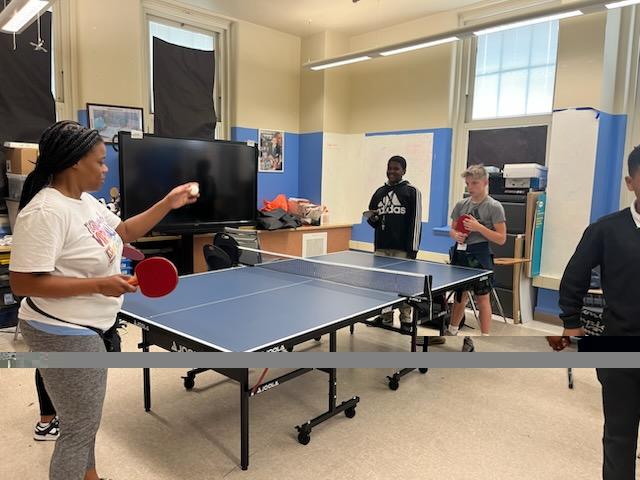 Let the games begin.  Students put the ping pong table together.  Experiential learning at it's best. They put it together and then began learning to play the game.