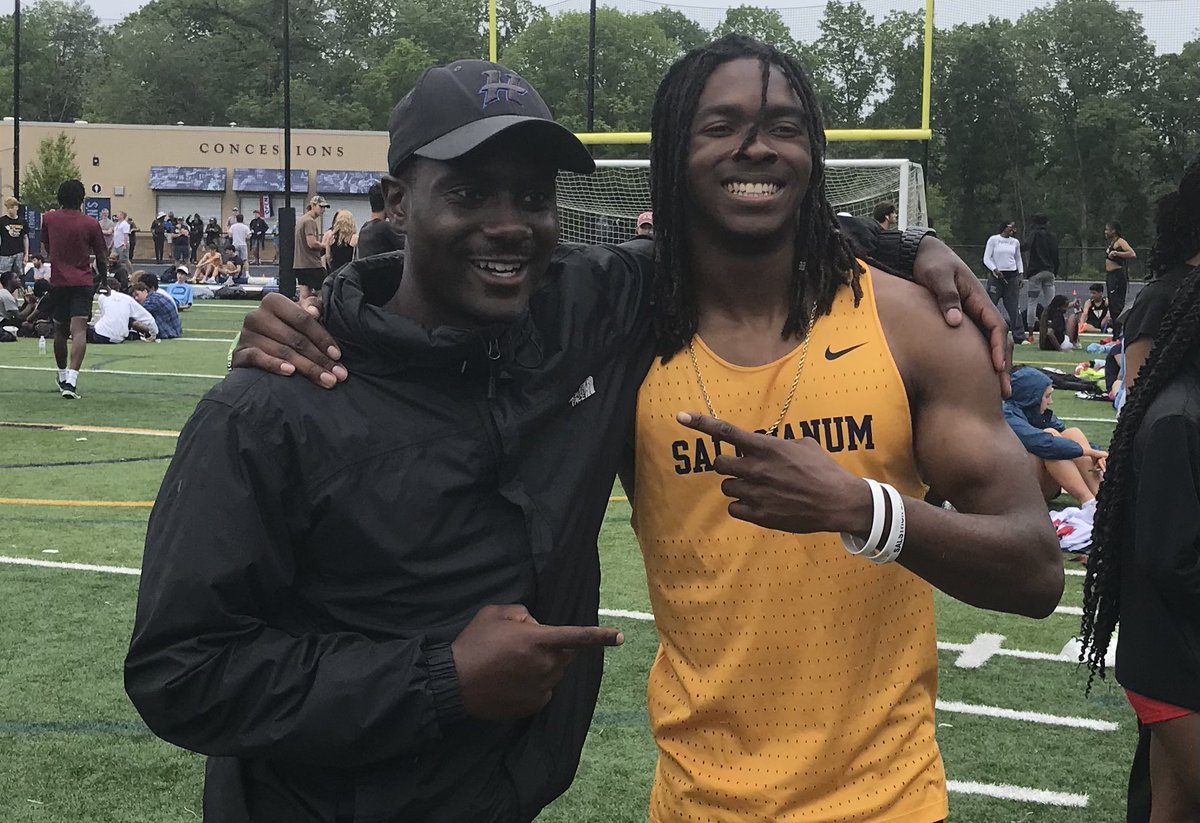 Jasyn Truitt (right) of @Salesianum sets a state record of 21.24 in the 200-meter dash at the New Castle County Track and Field Championships and is congratulated by previous record holder Edwin Rosembert, who ran 21.36 for Howard in 2017 #delhs