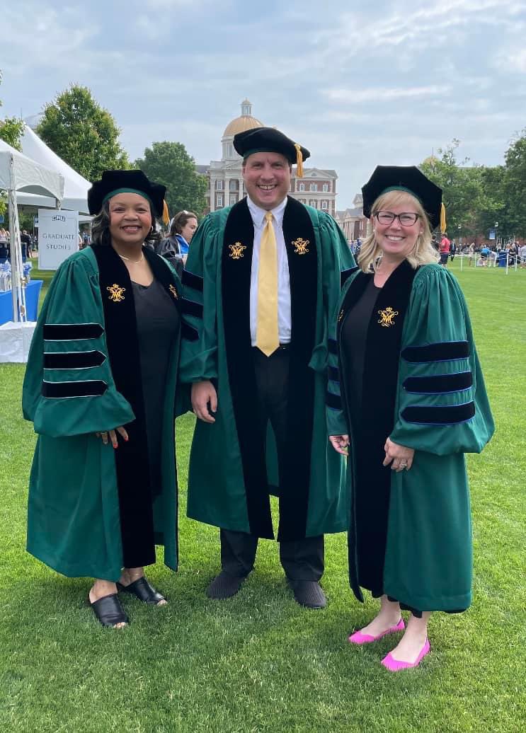 sheuvel's tweet photo. A great day today at @CNUcaptains 2023 Commencement! Here I am with some of my faculty/staff colleagues who are fellow William & Mary doctoral alums! #CaptainForLife 💙🤍, #TribePride 💚💛 https://t.co/46BYfub0UM