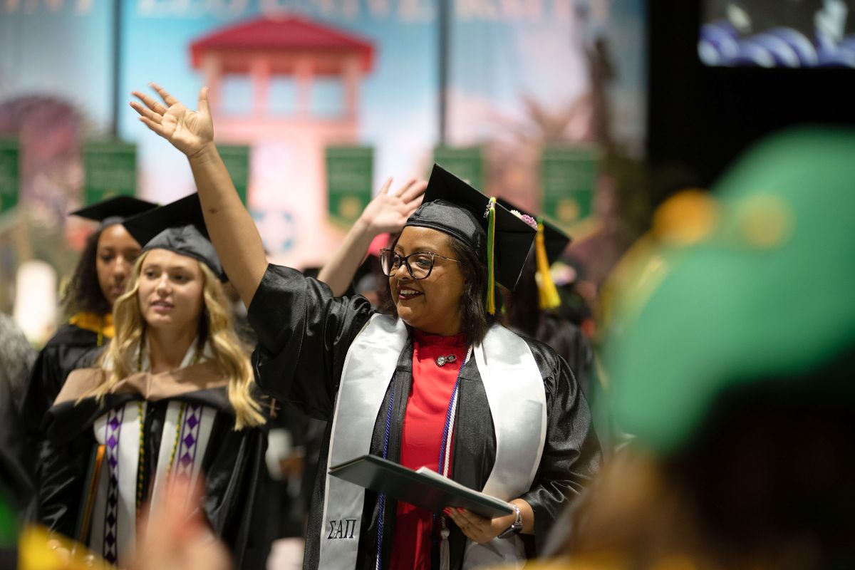 SaintLeoUniv's tweet photo. Trustee and alumnus Kevin Sullivan ’13 officially welcomed this afternoon’s graduates to the alumni association. "You may now turn your tassels from right to left. In doing so, please note that the tassel is over your heart. May Saint Leo always be within your heart." https://t.co/3XRVilLB2Y