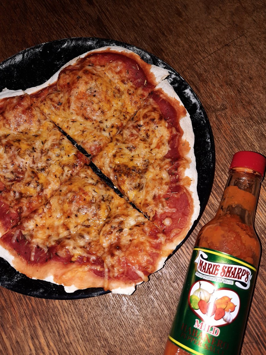 Mia_Schwarz_13's tweet photo. Pizza (selfmade, tomato-sauce, cheese, Oregano) with a side-dish of Marie Sharp's hot sauce for breakfast! My recent favortie! 
Is this self-care or a terrible diet? Hope it's at least a bit of both 🍀🍀 #pizza #pizzapizza #mariesharp https://t.co/OuEoUpfmzO