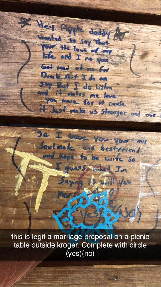Marriage proposal on picnic table outside kroger. Circle (yes)(no)