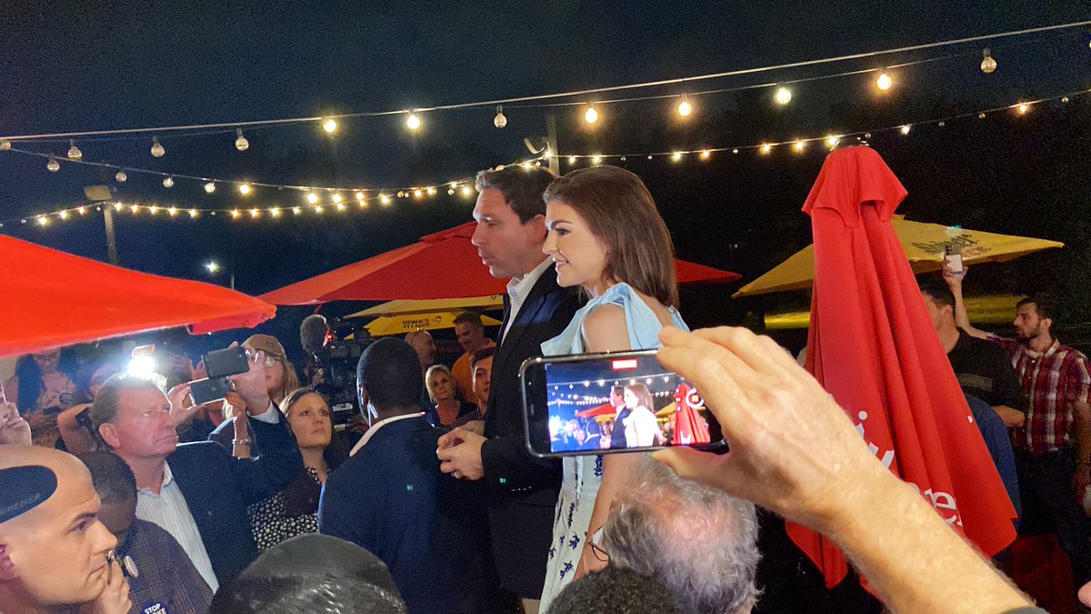 brianneDMR's tweet image. After Donald Trump canceled his Des Moines rally for inclement weather, Ron DeSantis added an unscheduled stop at a BBQ restaurant just down the road from where Trump was set to appear. He and his wife Casey are standing on a table talking to the crowd now