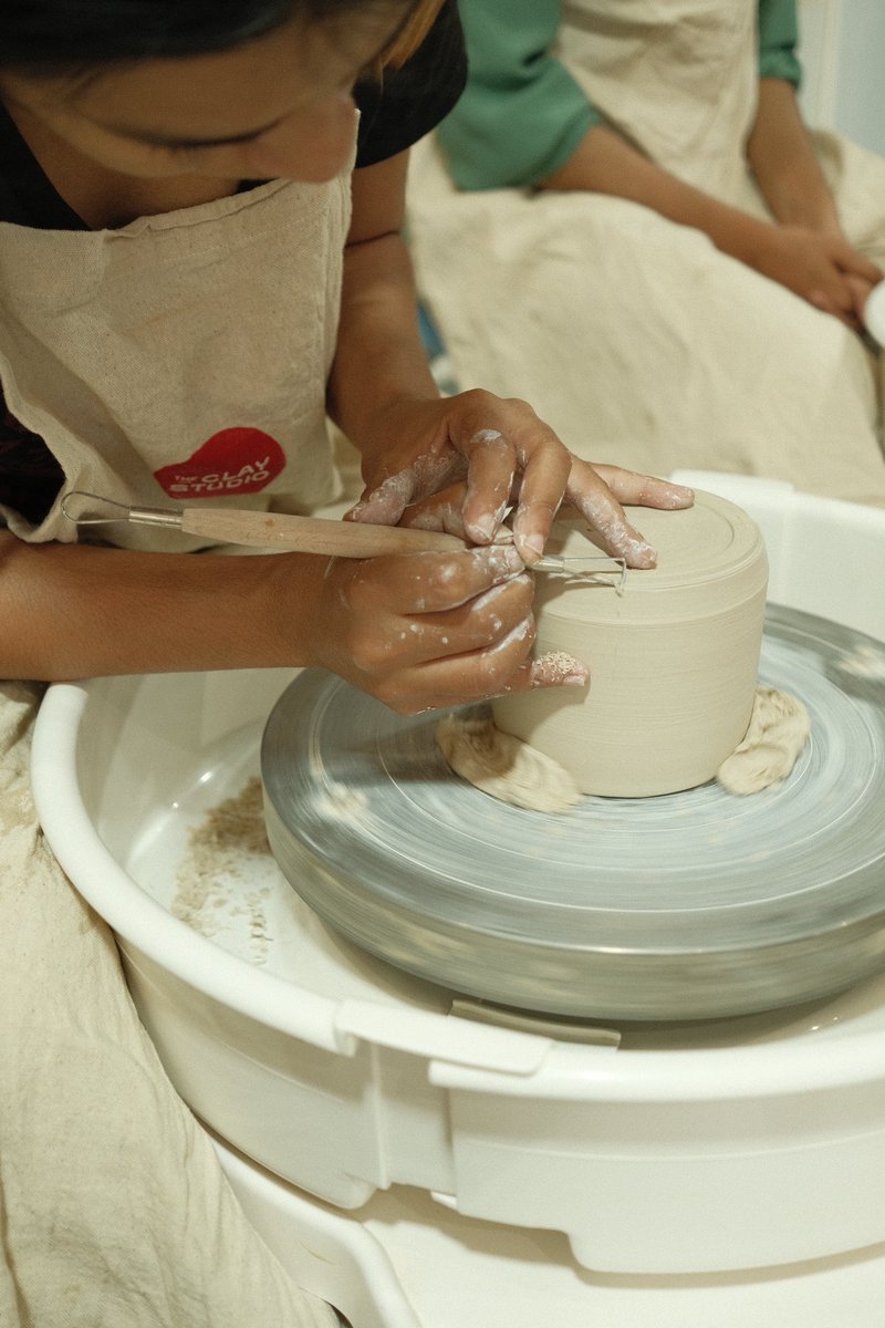 Experience the grace and precision of trimming on the wheel. Join us on this journey of craftsmanship and witness the evolution of clay into masterpieces!