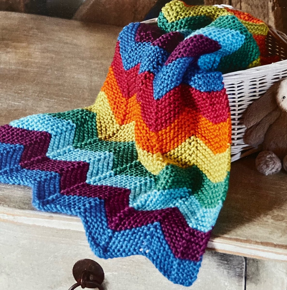 Knitted Chevron Rainbow Blanket Pattern #chevronrainbow #rugmaking #chevrons #rainbows #ssb #MHHSBD #earlybiz #sundaycrafts #rainbowblanket #knit #knittedblanket #knitting #knittingpattern etsy.me/3pu1KHa
