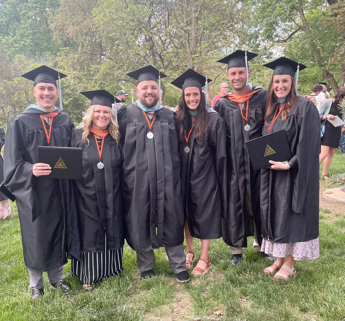 KelliWemhoff's tweet photo. Master of Education in Educational Leadership degree. 🎓🎉 I’m so thankful for my support system! 🧡 Also how how cute are these Doane Future Leader shirts from @BessScottDoane for our babies born during cadre?! 🥺 #thankful #grateful #blessed #graduate https://t.co/TEzhgcUhNN