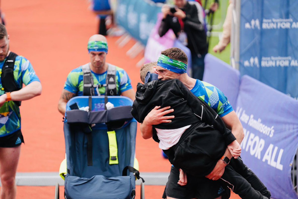 LDShospcharity's tweet photo. The emotional moment when Kevin carried @Rob7Burrow across the finish line of the first-ever Rob Burrow Leeds Marathon 🥹

“Run for a mate, with a mate.” The amazing power of friendship. 💜

#RunForRob #RobBurrowLeedsMarathon 

Photo credit: Tim Zoltie - TZ photography https://t.co/VRa7V0BUKb