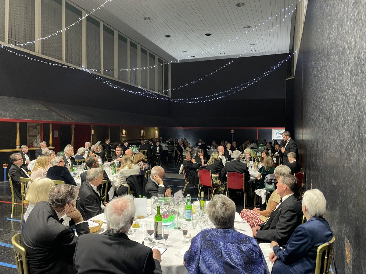 Rothwell_P's tweet photo. Nearly 100 @oldwarwickians attended the President’s Dinner at Leamington Tennis Court Club this weekend. Pictured: @Warwick_School Head Master Mr Barker addressing OWs and guests on court. https://t.co/DaKN4Sk7lN